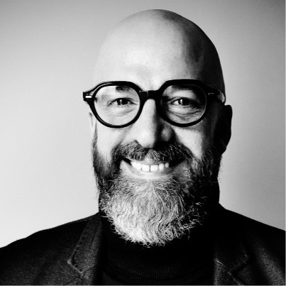 Christophe Muratet, xwedu Senior Lead Mentor for emerging technology and dual-use strategy, in a black and white portrait wearing thick-rimmed glasses
